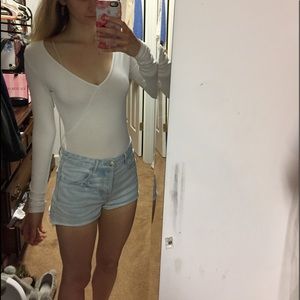 Very flattering white long sleeve body suit!